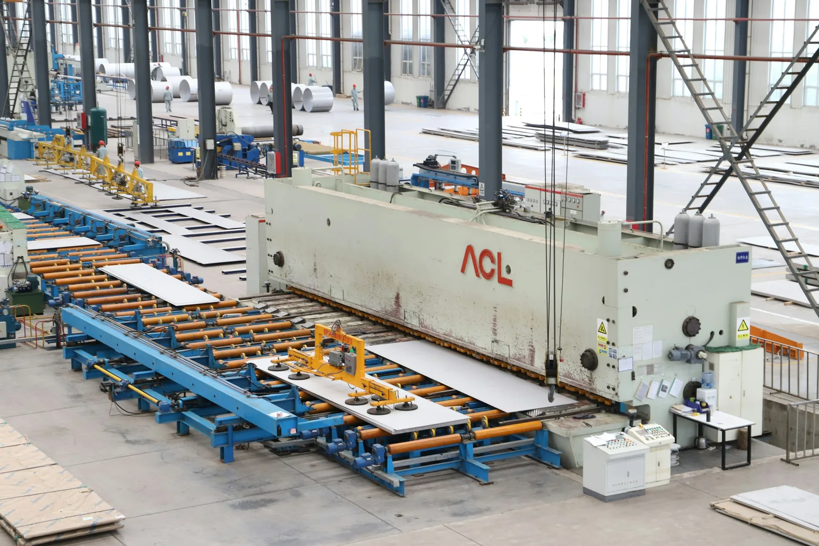 Industrial machinery operating across a large manufacturing floor
